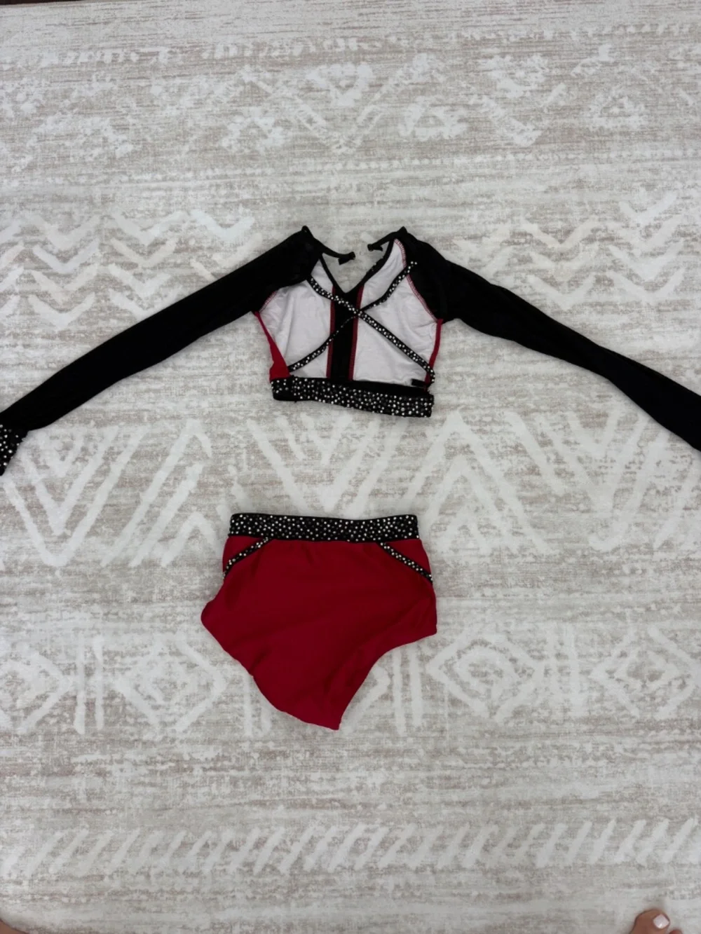 Jazzy red and black two-piece costume. bedazzled.